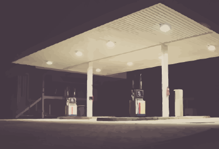 A picture of a petrol station at night.