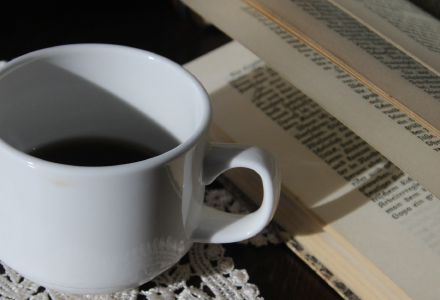 A picture of some coffee and a book.